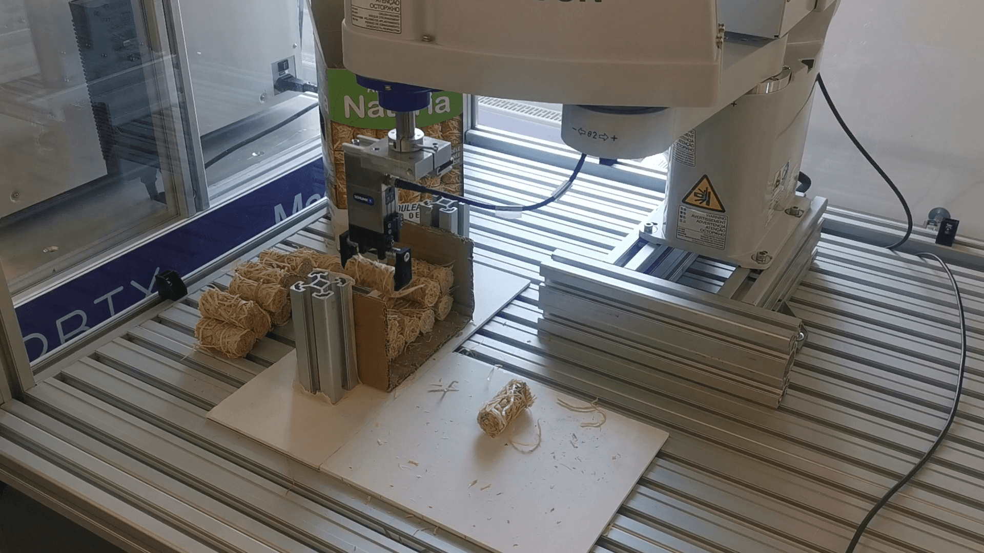 Automated packaging of barbecue lighter with a SCARA robot